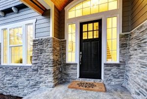 A Colorado front entry door with lit windows